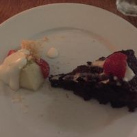 Vegan Chocolate Cake Slice with Small Fruit Salad Side at Black Bear Cafe in Belfast
