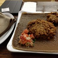 Misir Wat (Lentil stew, the larger portion) and Shiro (seasoned pea flour paste, smaller portion) on injera at Nile Ethiopian in Richmond