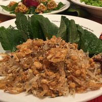 Pomelo Salad w/ crispy deep-fried garlic and crunchy bits, which you wrap in Betel Leaves - so refreshing and tasty! at Khun Churn - Eathai in Bangkok
