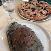 veganspeck pizza and ";calzone2"; with the charcoal dough! at Il Papiro in Milan
