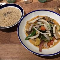 Panang red curry (vegan) with lots of veg, delicious strips of young Thai coconut, peanuts and brown jasmin rice sprinkled with chia seeds! tasty and filling and not too spicy! at Flax & Kale - Placa Castella in Barcelona