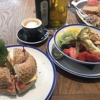 PB bagel, coconut yogurt granola parfait bowl and scramble! at Flax & Kale - Placa Castella in Barcelona