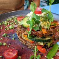 Potato rosti with vegetables and garlic sauce at Green Pumpkin in Riga