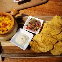 Vegan nachos with spicy beans & cheese in the bowl ~ Yum! at The Shroom Room in Christchurch