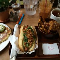 Brunch: 'Dogter Dre' hot dog (with guacamole), side dish of plantains and corn, pancakes, juice and hot beverage. All vegan. at Le Tricycle in Paris