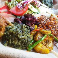 Half a plate of vegan friendly stuff on bread. To be eaten as is with your hands, using the bread to not get them too dirty, haha ?. Very nice! at Makamba in Stuttgart