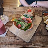 Patatas bravas, tea, Smoothie, eggplant toast at The Juice House in Barcelona