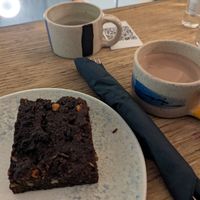 Hot cocoa with oat milk and a vegan brownie at InLoveAgain in Athens