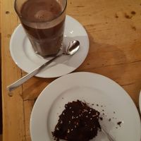 Hot chocolate with almond milk and a brownie at Schiller's in Heidelberg
