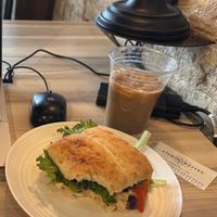 Hummus sandwich and oat milk iced chai latte at Atomic Coffee in Fargo
