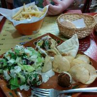 Falafel plate and a side of french fries at Falafel Nessya in Playa Del Carmen