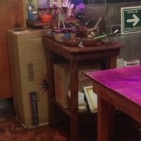 Cart with various condiments and sauces at Falafel Nessya in Playa Del Carmen