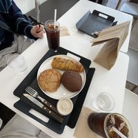 Garlic bread, chocolate peanut cream bread, 3rd thing i don’t remember, iced americanos  at The Bread Blue - Nogosan in Seoul