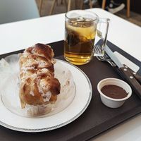 Cinnamon roll with peppermint tea. The peanut sauce was offered at The Bread Blue - Nogosan in Seoul