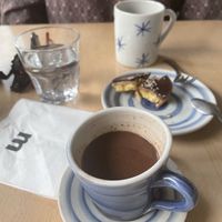 Hot chocolate on soy milk and cake with salted caramel   at Mamacoffee in Prague