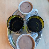 A couple of hot chocolates with oat milk at Mamacoffee in Prague