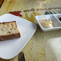 Bread and vegan butter (ask) I forgot what the spread was but it was delicious I could have gotten full of just this!   at Yemanja Woodfired Grill in Oranjestad