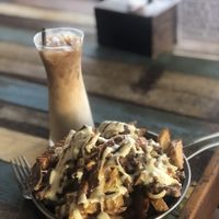 Cheesy Kebab Chip Bomb with Iced Coffee at Eat.Co in Koh Phangan