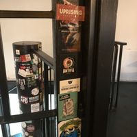 Animal rights stickers next to other, more traditional social justice stickers  at Belzepub in Prague