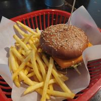 Fried cheese burger with fries at Belzepub in Prague
