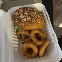 Nochicken burger with onion rings  at Belzepub in Prague