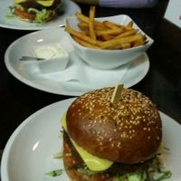 Vegan Swiss burger with fries and soyanaise at Belzepub in Prague