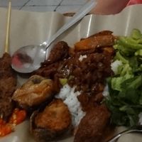 Some great mock meats, satay, greens, and Chinese 'pork'. at Vegetarian Restaurant in Jakarta