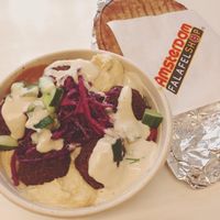 Falafel salad: looks like it's all sauce and hummus but there were more veggies under there, I promise! Pita on the side. at Amsterdam Falafelshop - L'Enfant Plaza in Washington