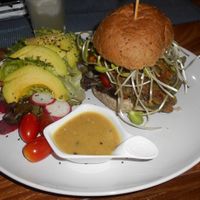 Bubbles Live > almost inedible Veggie Burger with yummy Avocado Salad at Bubbles Live in Chiang Mai