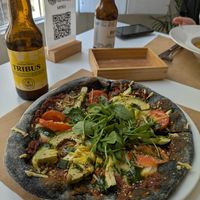 Black pizza at El Vergel Veggie Restaurant in Tarragona