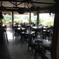 view of restaurant facing the balcony overlooking the rice terraces and ridge at Elephant Cafe in Ubud
