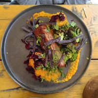 Shroom steak with carrot puree, coriander pesto, roasted corn and broccoli at GYS - Voorstraat in Utrecht