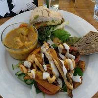 Small vegan tasting platter: half a burger, bread with guacamole, some 'kapsalon' and a curry. at GYS - Voorstraat in Utrecht