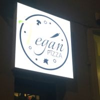 sign outside  at Vegan Pizza in Warsaw