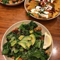 Kale Caesar salad and nachos at Veggie Grill by Next Level in Pasadena