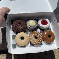Middle in the top is called Bavarian Creme, bottom left is cinnamon sugar, and top right is strawberry jelly. Can’t remember the names of the others but they are all amazing! at Broad  Street Dough Co in Oakhurst