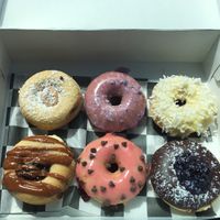 $13.99 for 6 and about $0.40 extra per specialty donut at Broad  Street Dough Co in Oakhurst