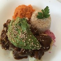 Cauliflower with mole sauce, sweet potatoes puree, brown rice and avocado. at Co.ConAmor in Tulum