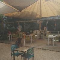Outdoor dining under a parachute at Co.ConAmor in Tulum