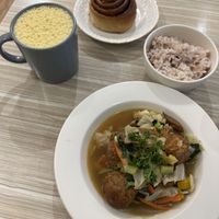 Stewed veggie balls in ginger soy sauce, hot pumpkin soymilk, and a cinnamon roll.  at Rice Revolution 呷米蔬食 - Gā Mǐ Shū Shí in Taipei