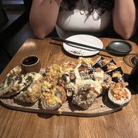 Sushi spread left to right. Fried avocado, croque madame, Mr. Croquant, Kamikaze   at Sushi Momo in Montreal