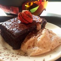 Delicious vegan brownie with coconut cream at Raven's Nest!  Yum! at Raven's Nest in Whistler