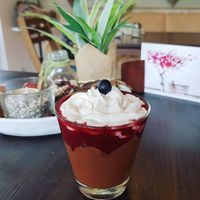 chocolate red berry desert with whipped cream at Veganatural in Giessen