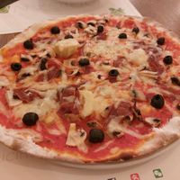 Pizza with vegan ham, black olives, mushrooms and  artichoke at Origano Trevi in Rome