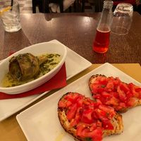 Bruschetta in front, artichoke alla romana in back. at Origano Trevi in Rome