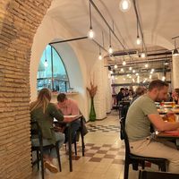 The dining area (and part of the kitchen). at Origano Trevi in Rome