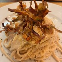Cacio & pepe spaghetti with friend artichoke.    at Origano Trevi in Rome