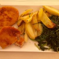 Breaded soy cutlet with potatoes and spinach at Origano Trevi in Rome