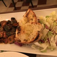 Eggplant and tomato served with salad and bread at Origano Trevi in Rome