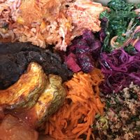 A little bit of everything: refried black beans, rice, zucchini, kimchi,... at Jungle Cafe in Brooklyn